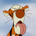 Winnie the Pooh's Tigger. He is grimacing with his tongue hanging out.